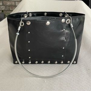 Handbag: funky industrial style design with cable handles and hardware details.